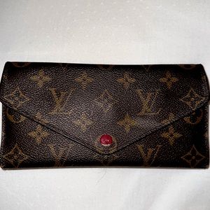 Authentic Louis Vuitton Sarah wallet. In fair condition retails for $720.